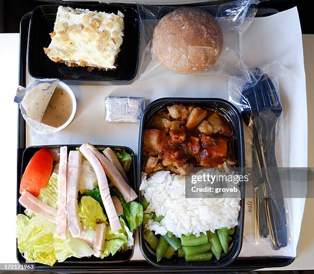 dinner on an airplane - plane food stock pictures, royalty-free photos & images