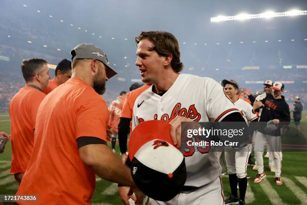 Adley Rutschman of the Baltimore Orioles celebrates after the Orioles defeate the Boston Red Sox to win the American League East at Oriole Park at...