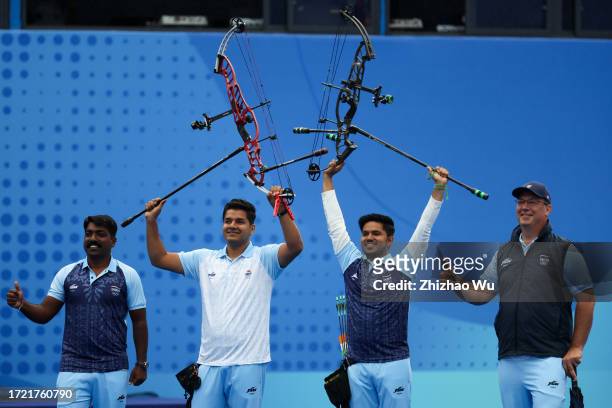 Abhishek Verma of India and Ojas Pravin Deotale of India celebrate after the Men's Individual Gold Medal Match of Archery Compound during day 14 of...