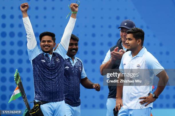 Abhishek Verma of India and Ojas Pravin Deotale of India celebrate after the Men's Individual Gold Medal Match of Archery Compound during day 14 of...