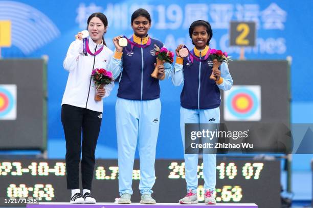 Gold medallist Jyothi Surekha Vennam of India, Silver medallist So Chaewon of South Korea, Bronze medallist Aditi Gopichand Swami of India attend the...