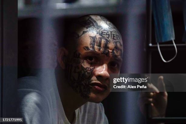 Member of the "Mara Salvatrucha" gang remains in a cell inside at CECOT on October 12, 2023 in Tecoluca, El Salvador. On February of 2023 El Salvador...