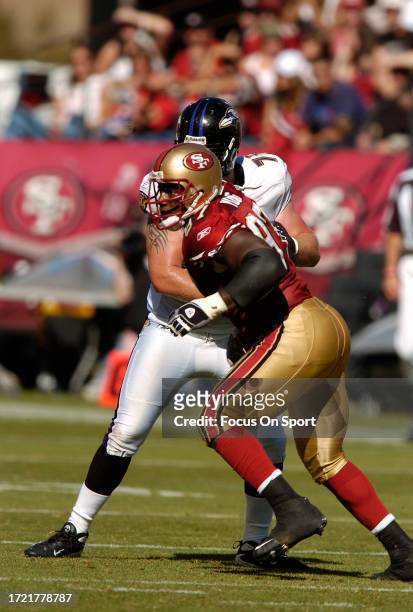 Bryant Young of the San Francisco 49ers rushes up against Marshal Yanda of the Baltimore Ravens during an NFL football game on October 7, 2007 at...