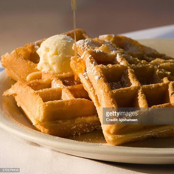 belgian waffles with butter and syrup - syrup stock pictures, royalty-free photos & images