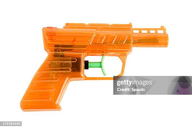 orange water gun 3 - water pistol stock pictures, royalty-free photos & images