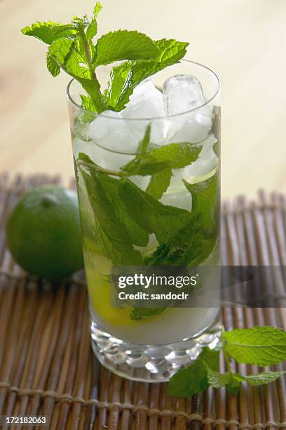 mojito with lime and leaves in a glass - mojito stock pictures, royalty-free photos & images