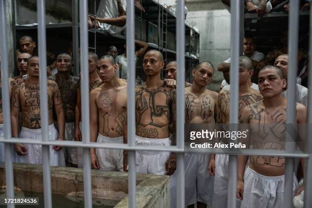 Members of the "Mara Salvatrucha" and "Barrio 18" gangs remain in a cell at CECOT on October 12, 2023 in Tecoluca, El Salvador. On February of 2023...