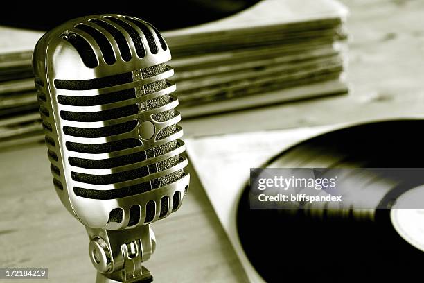 vintage radio microphone with vinyl records - vintage microphone stock pictures, royalty-free photos & images