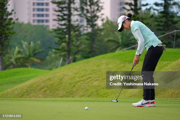 Saipan of Thailand holes the winning putt on the 18th green during the play off first hole following the final round of Kanehide Miyarabi Open at...