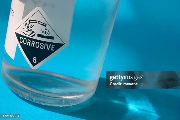 acid bottle - corrosive stock pictures, royalty-free photos & images