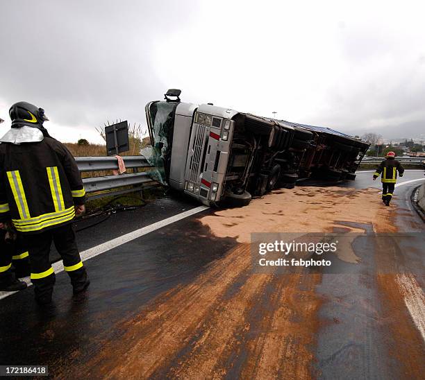 wrecked gray overturned bus on the side of the road - accident stock pictures, royalty-free photos & images