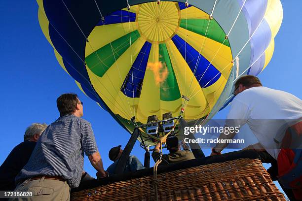 ballooning - holding the gondola before starting - hot air balloon people stock pictures, royalty-free photos & images