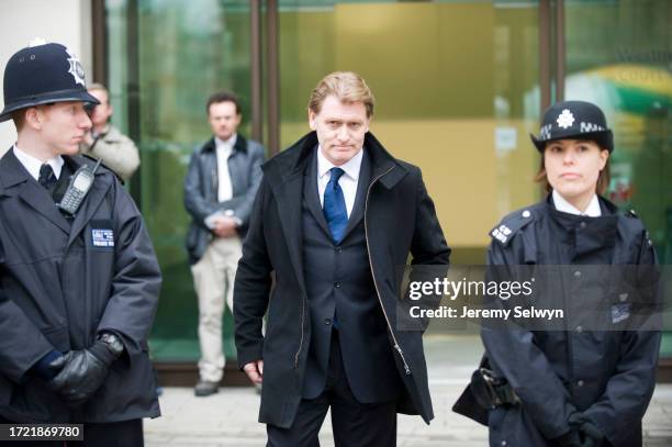 Labour Mp Eric Joyce Is Flanked By Police Officers As He Leaves Westminster Magistrates¿Court, London..Labour Mp Eric Joyce Now Faces Pressure To...