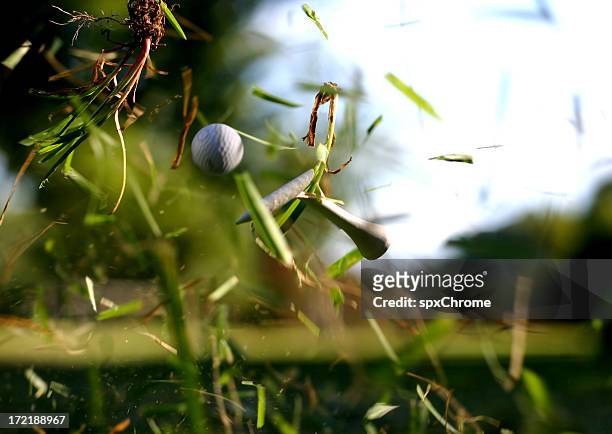 broken tee with golf ball in flight - golf ball stock pictures, royalty-free photos & images