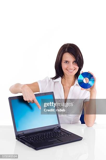 beauiful woman - presentation with laptop and cd - class rom stock pictures, royalty-free photos & images