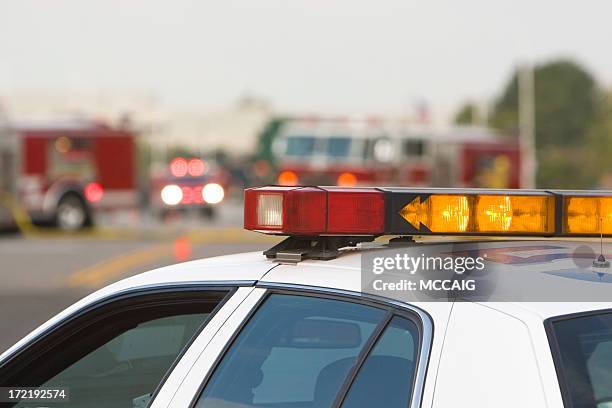 a police car in an emergency rescue scene  - brandweerwagen stockfoto's en -beelden