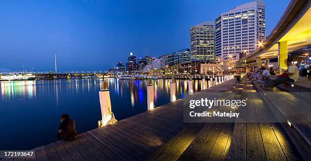 lit up sydney darling harbor at night - darling harbor stock pictures, royalty-free photos & images