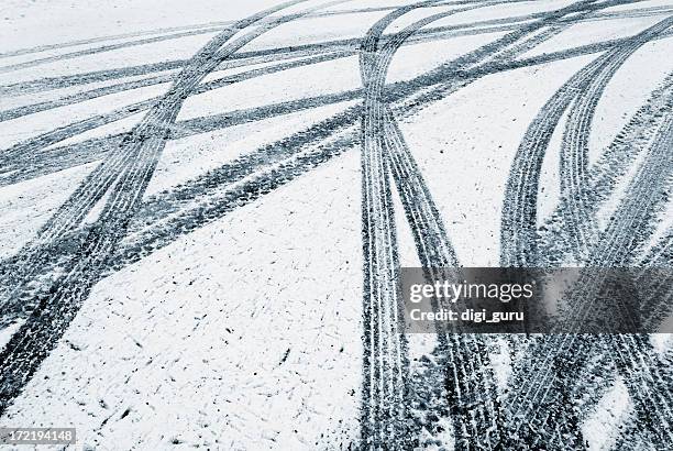 tire tracks in the fresh snow - ice stock pictures, royalty-free photos & images