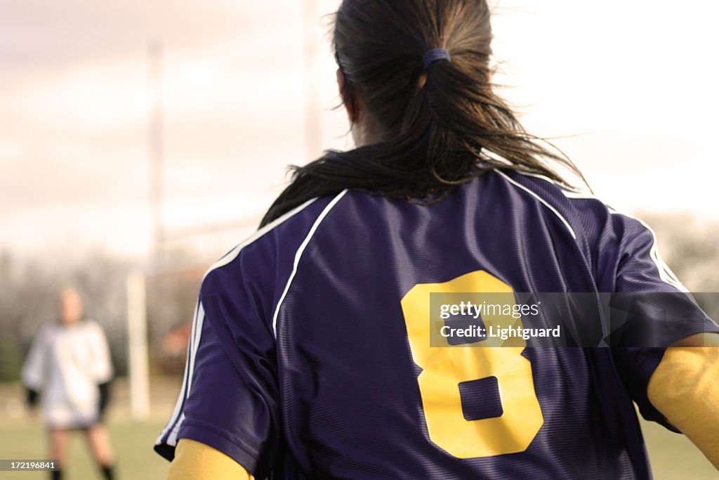 Back view of female soccer player in number 8 jersey