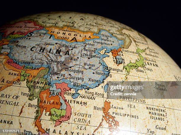 asia on world globe - east asia stock pictures, royalty-free photos & images