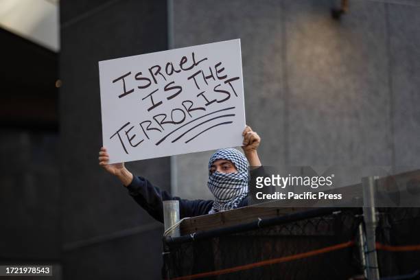Students from Hunter College participate during a pro-Palestinian demonstration at the entrance of their campus. The pro-Palestinian student...