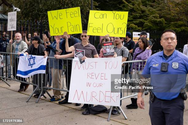 Jewish counter protesters shout and waves signs at students from Brooklyn College during a pro-Palestinian demonstration at the entrance of the...