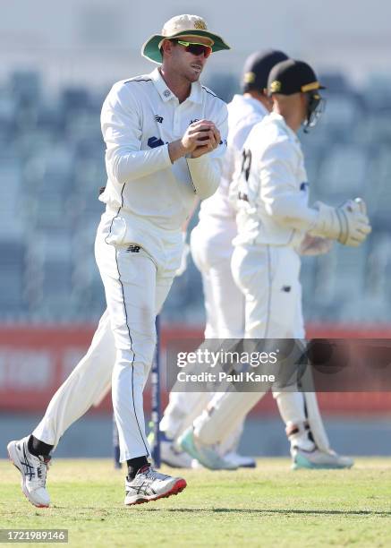 Ashton Turner of Western Australia holds a catch to dismiss Scott Boland of Victoria and to win the Sheffield Shield match between Western Australia...