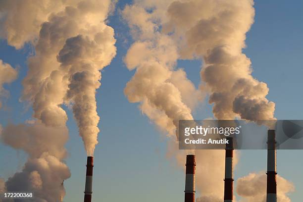 blye sky and exhaust smoke - factory smog stock pictures, royalty-free photos & images