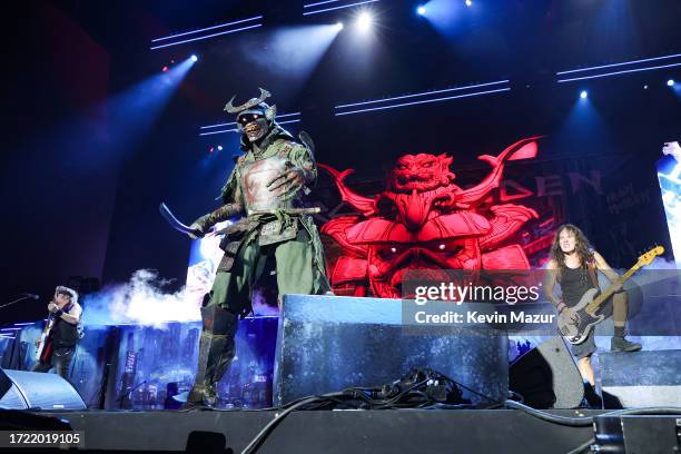 Adrian Smith and Steve Harris of Iron Maiden perform onstage with a costumed samurai during the Power Trip music festival at Empire Polo Club on...