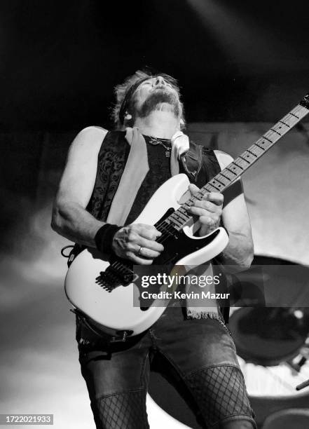Adrian Smith of Iron Maiden performs onstage during the Power Trip music festival at Empire Polo Club on October 06, 2023 in Indio, California.