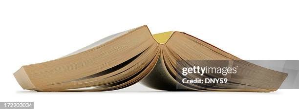 paperback book open and turned upside down on white background - paperback stock pictures, royalty-free photos & images