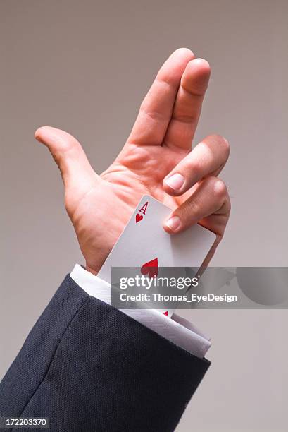 man holding an ace up the sleeve - ace of hearts stock pictures, royalty-free photos & images