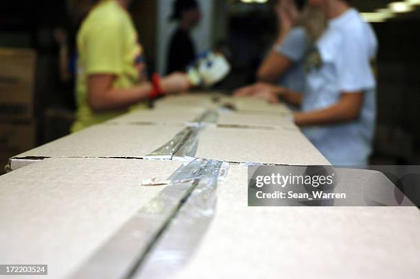 assembly line - team work - labor intensive production line stock pictures, royalty-free photos & images