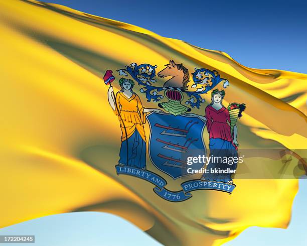 close-up of the yellow flag of new jersey - state flags stockfoto's en -beelden