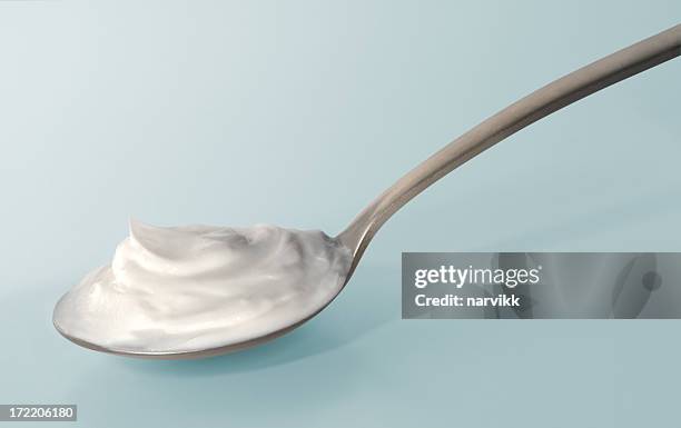 spoon with yoghurt - spoon stock pictures, royalty-free photos & images
