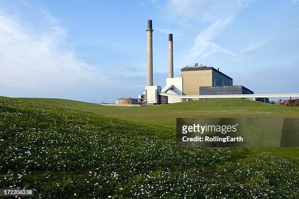 big lawn with power station at the background - power station stock pictures, royalty-free photos & images