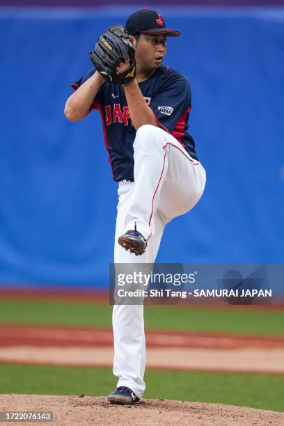 Junichi Tazawa of Team Japan throws a pitch in the 6th inning during the baseball bronze medal game between Japan and China on day fourteen of the...