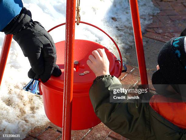 ragazzo di donazione - salvation army foto e immagini stock