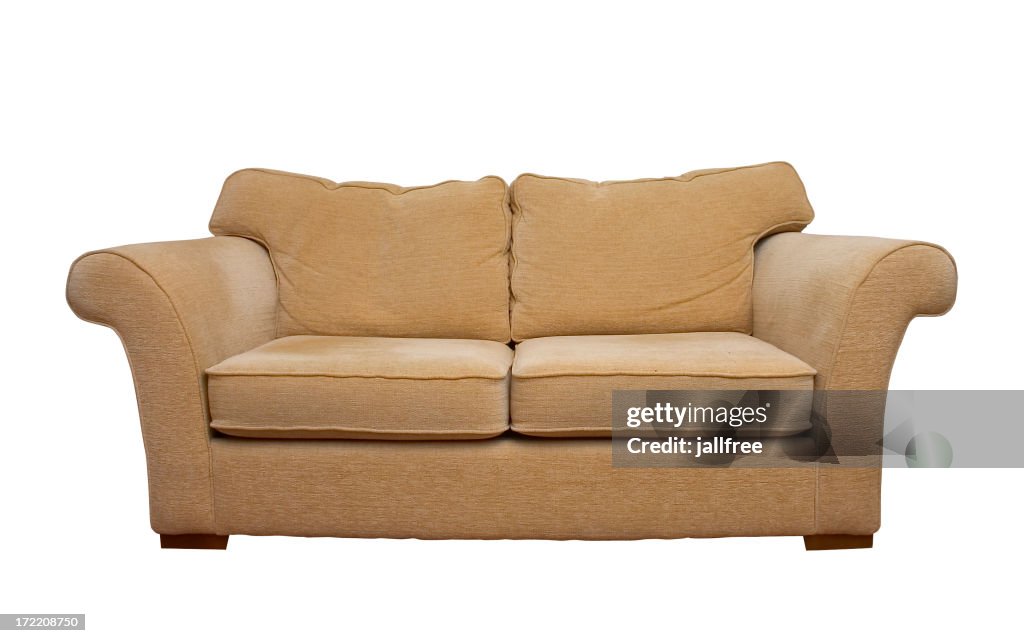 Cream comfortable sofa isolated on white background