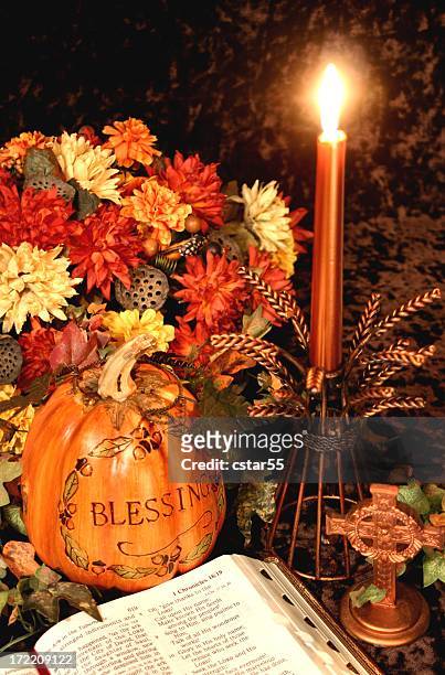 religious: thanksgiving table series with bible, autumn flowers - thanksgiving arrangement stock pictures, royalty-free photos & images