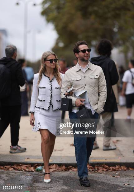 Derek Blasberg is seen outside Chanel show wearing black sunnies, white shirt, beige denim Tom Ford jacket and dark denim pants, Kelly Sawyer is seen...