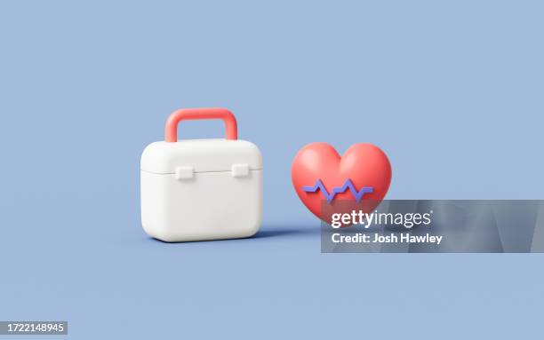 medical kit and heart in the blue background, medical concept, 3d rendering - trousse de secours photos et images de collection