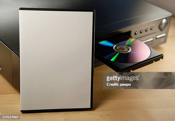blank dvd case on player - dvd speler stockfoto's en -beelden