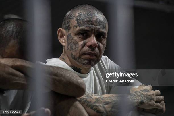Gang members of the 'Mara Salvatrucha' and 'Barrio 18' are seen in a cell at the Terrorism Confinement Center , of the municipality of Tecoluca, in...