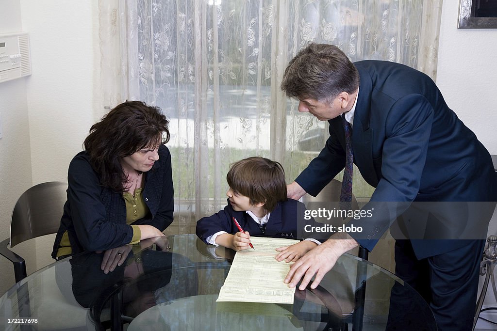 Child Signing Less Child Signing Documents While Surrounded By Two Adults High-Res Stock ...