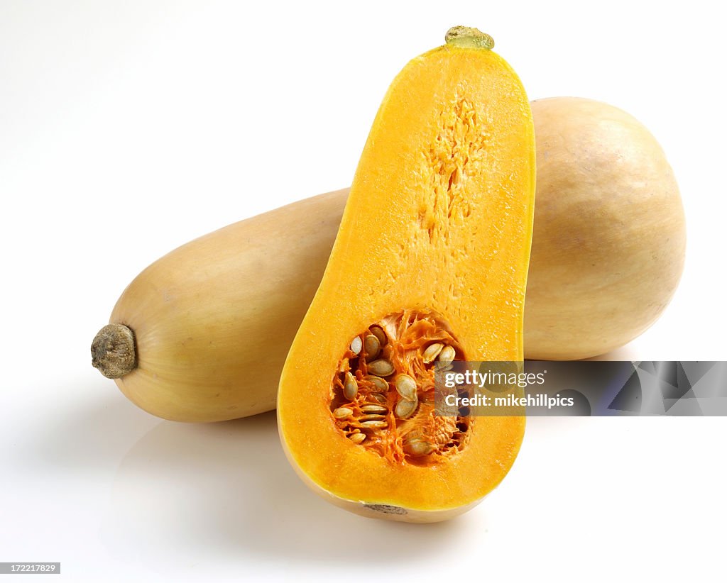 One whole and one half butternut squash sliced open