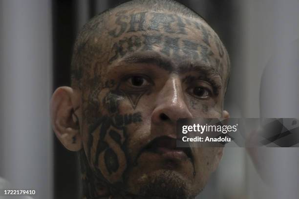 Gang members of the 'Mara Salvatrucha' and 'Barrio 18' are seen in a cell at the Terrorism Confinement Center , of the municipality of Tecoluca, in...