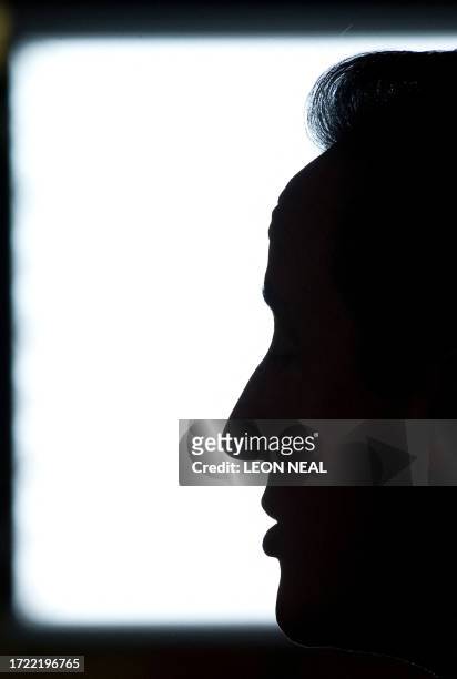 British Prime Minister David Cameron addresses employees of the airline EasyJet in the canteen of their offices at Luton airport in Hertfordshire, on...