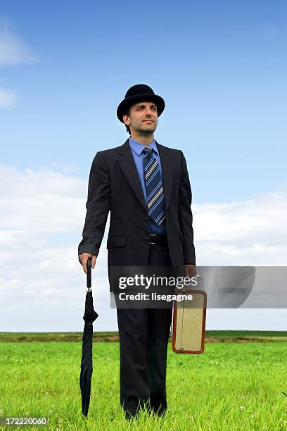 gentleman in a meadow - bowler hat stock pictures, royalty-free photos & images