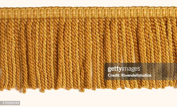 gold fringe - frayed stock pictures, royalty-free photos & images